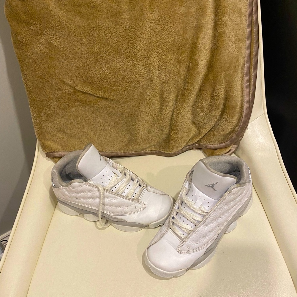 A pair of white Jordans size 6 youth.